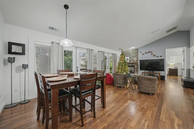 a view of a dining room with furniture window and wooden floor