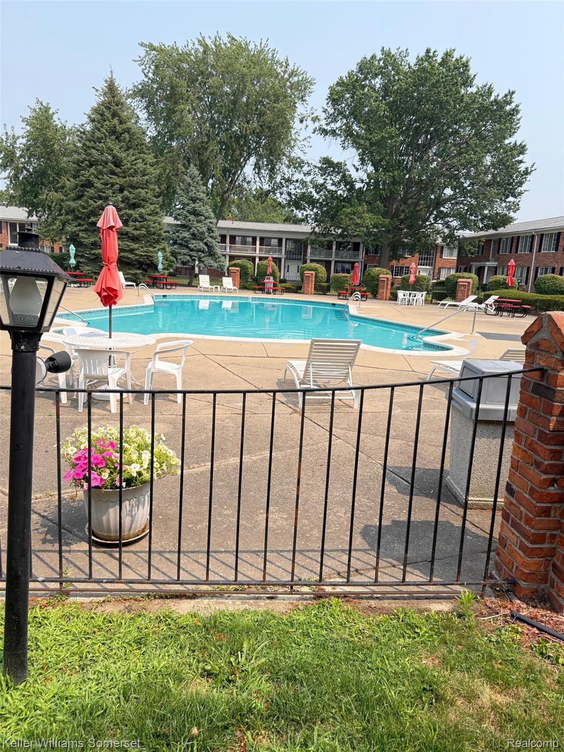 29626 Hoover Road, Unit 626 Warren, MI 48093 - Photo 32 of 35 Community pool featuring a patio