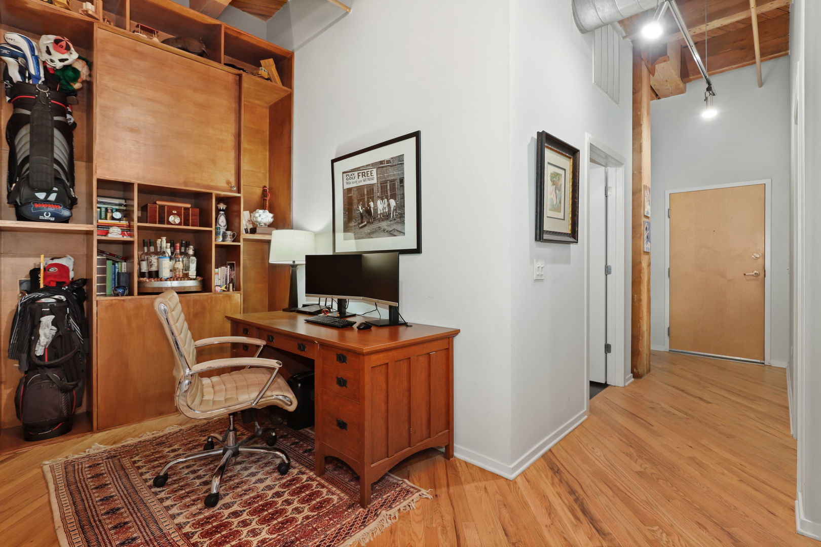 1040 West Adams Street, Unit 224 Chicago, IL 60607 - Photo 12 of 32 a view of a workspace with furniture and a window