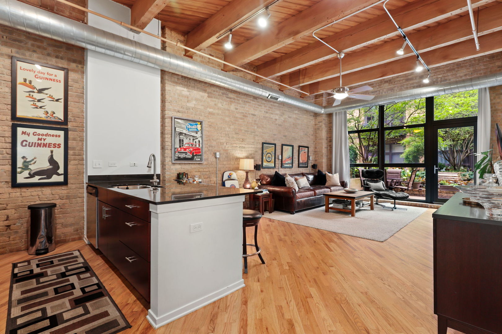 1040 West Adams Street, Unit 224 Chicago, IL 60607 - Photo 2 of 32 a very nice looking room with many windows and furniture