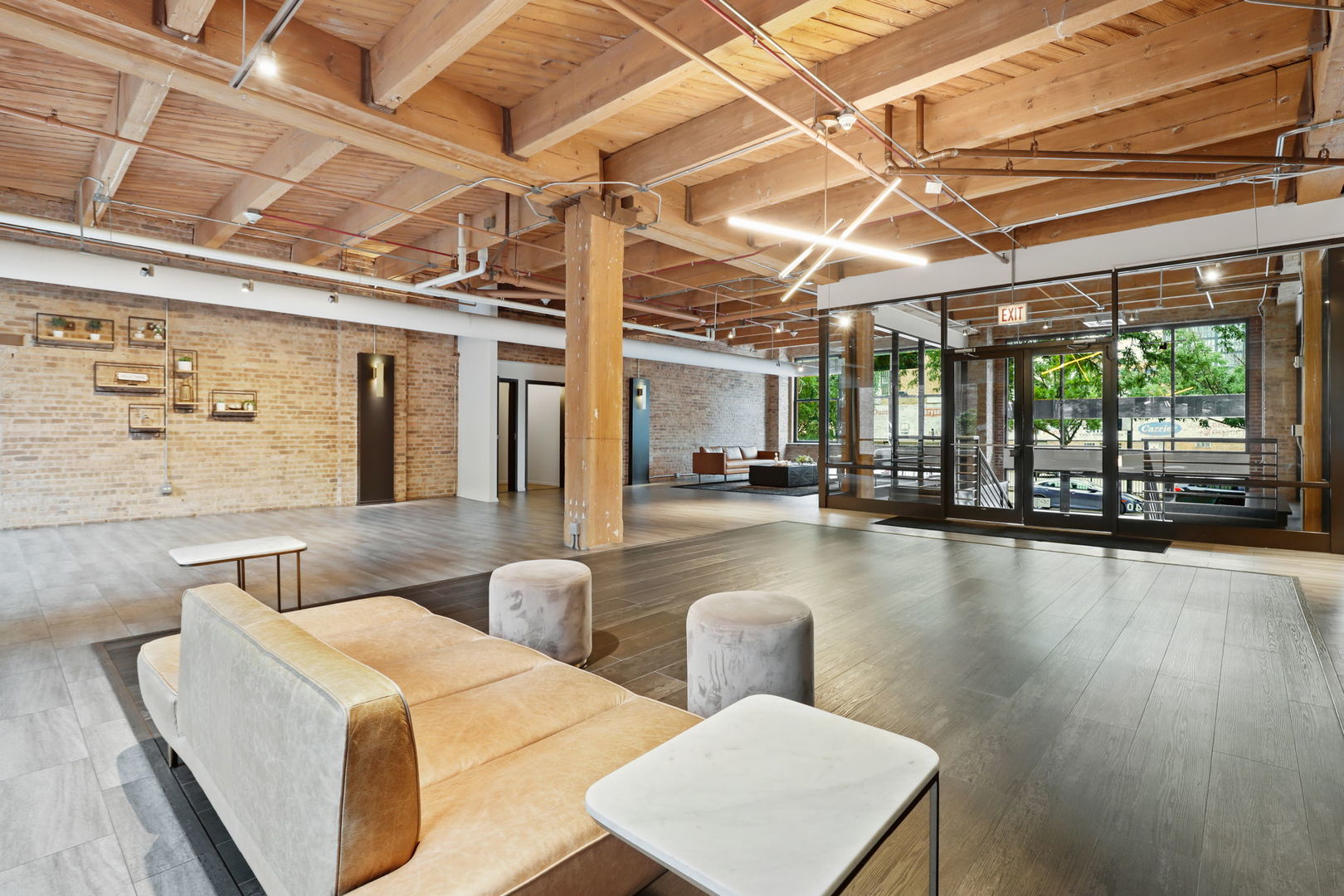 1040 West Adams Street, Unit 224 Chicago, IL 60607 - Photo 27 of 32 a lobby with furniture and a floor to ceiling window