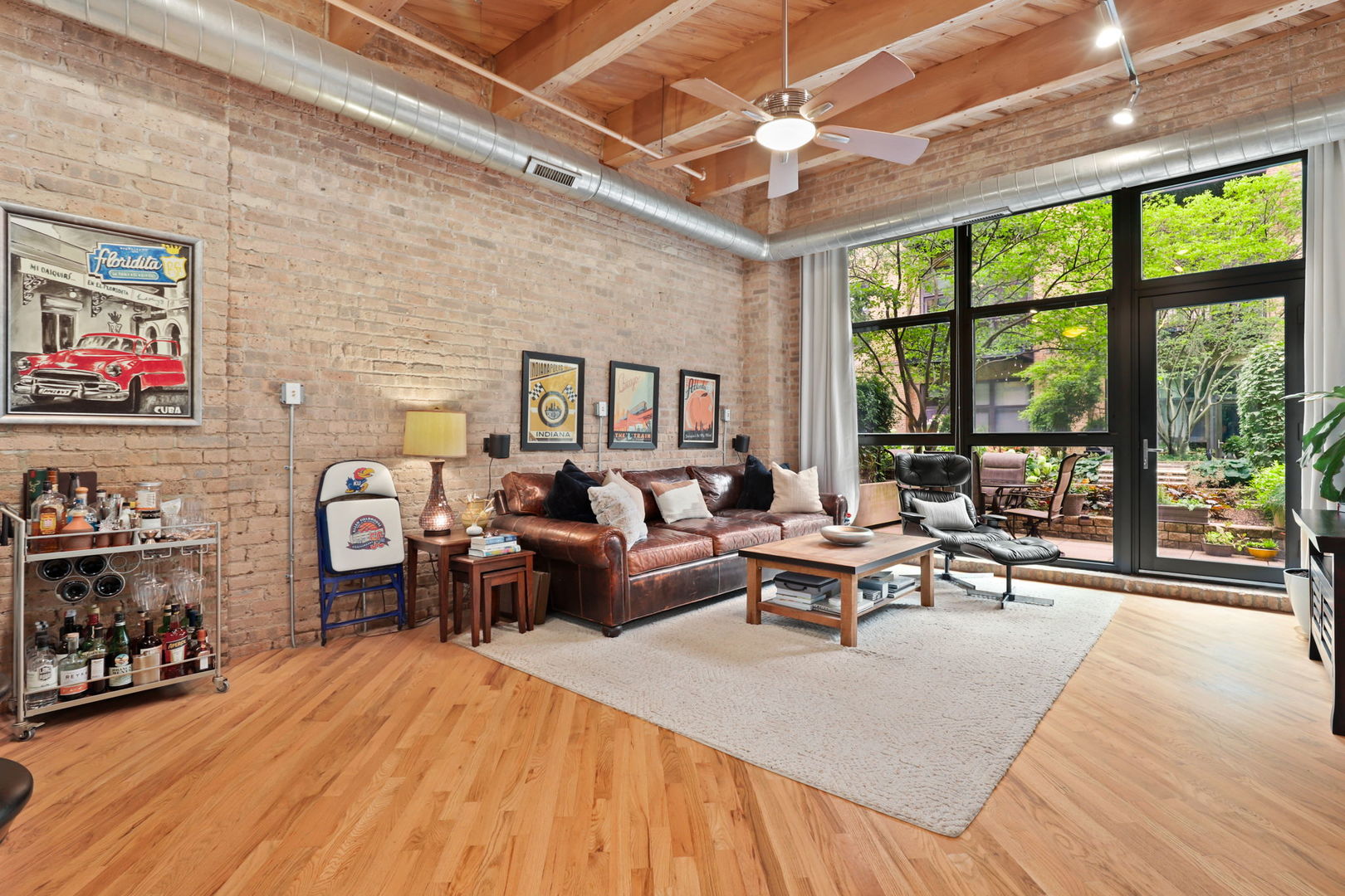 1040 West Adams Street, Unit 224 Chicago, IL 60607 - Photo 3 of 32 a living room with furniture and a large window