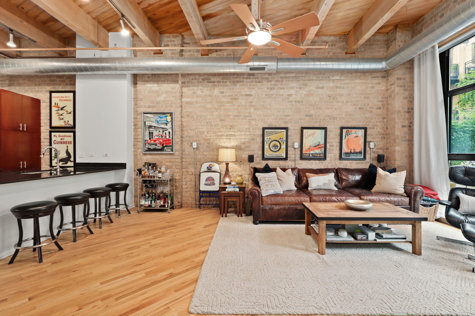 1040 West Adams Street, Unit 224 Chicago, IL 60607 - Photo 7 of 32 a reading room with furniture and wooden floor