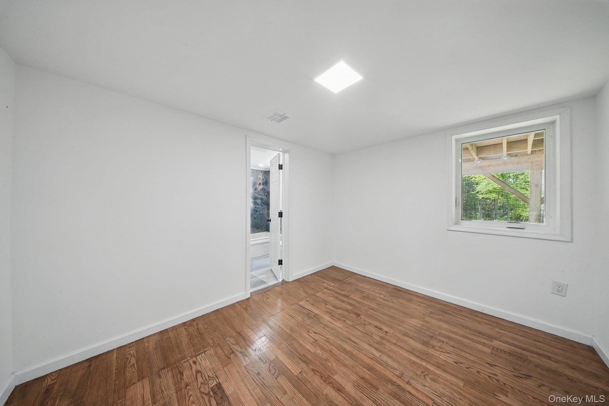 206 High Road Glen Spey, NY 12737 - Photo 11 of 42 wooden floor in an empty room with a window