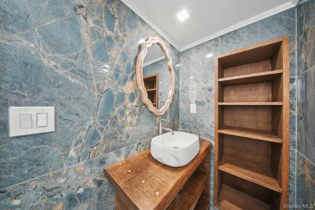 a bathroom with a sink and a mirror