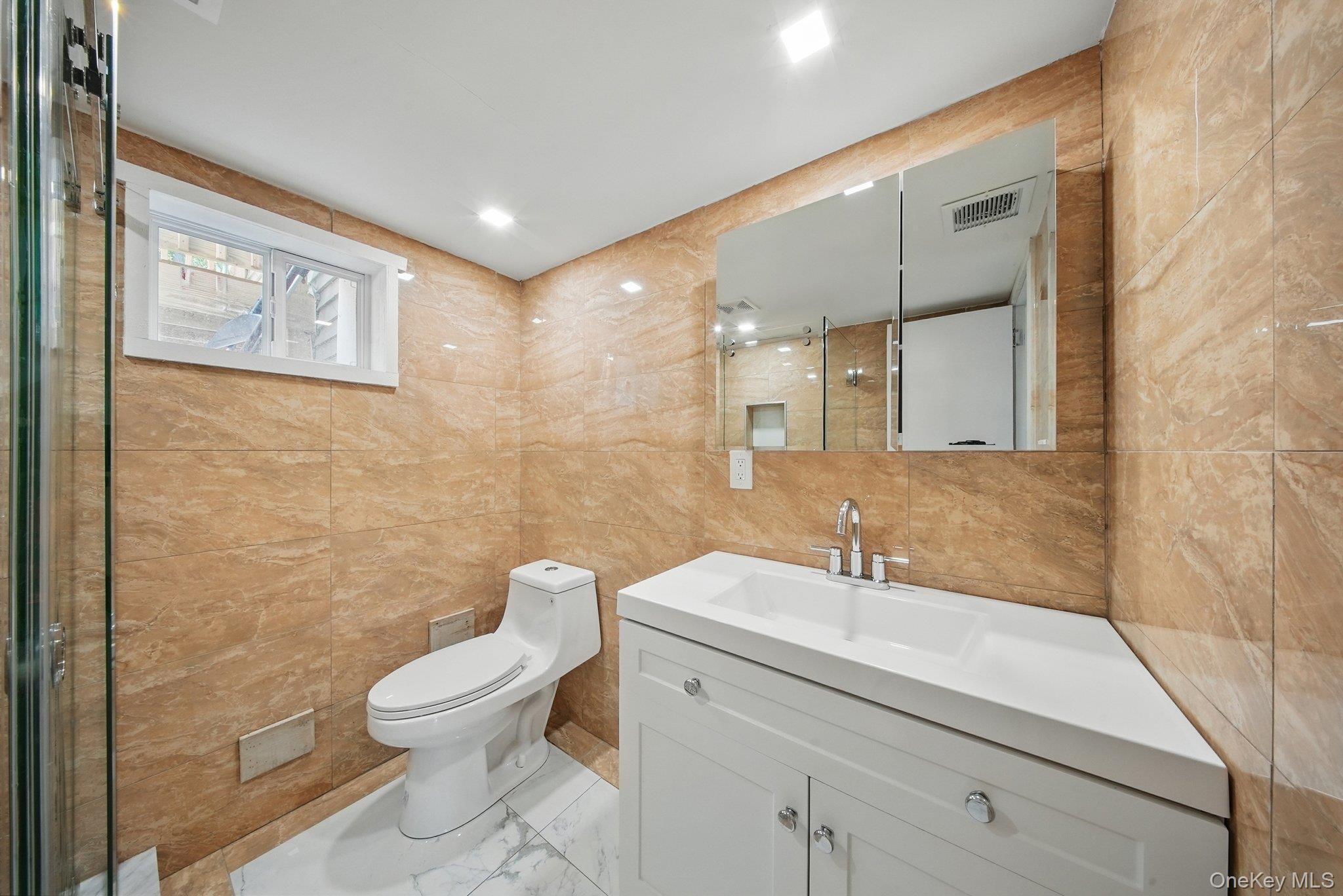 206 High Road Glen Spey, NY 12737 - Photo 17 of 42 a bathroom with a toilet sink and mirror