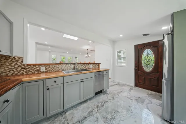 a bathroom with a sink a vanity and mirror