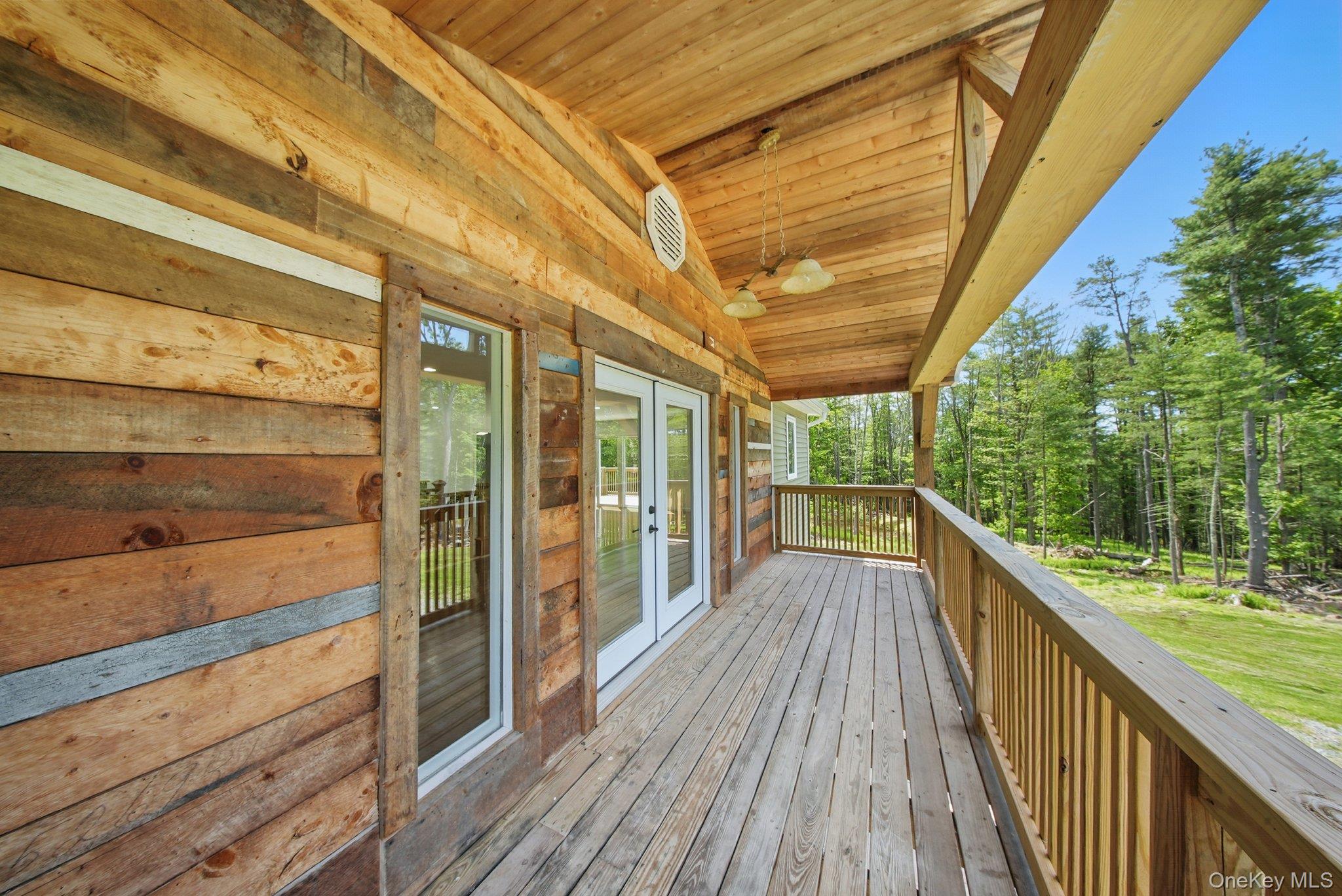 206 High Road Glen Spey, NY 12737 - Photo 37 of 42 a view of balcony with wooden floor and outdoor space