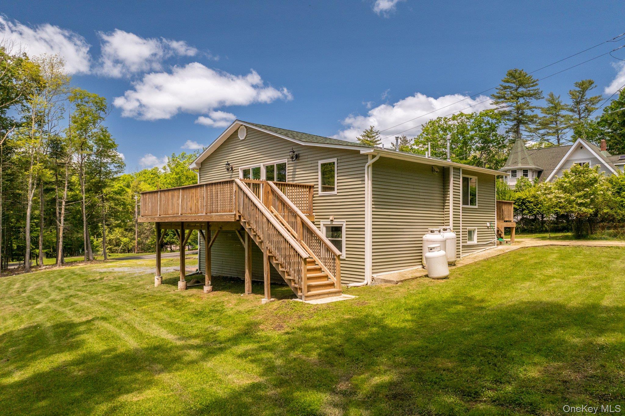 206 High Road Glen Spey, NY 12737 - Photo 40 of 42 a view of a house with a yard and sitting area
