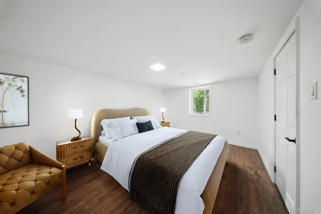 a bedroom with bed and window