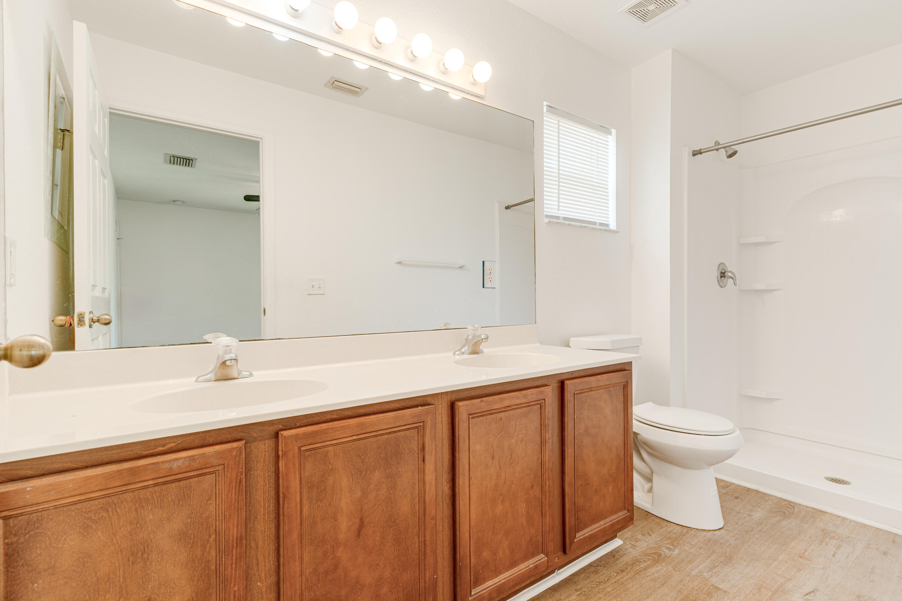 500 Topeka Road Southwest Palm Bay, FL 32908 - Photo 11 of 12 a bathroom with a sink and a toilet