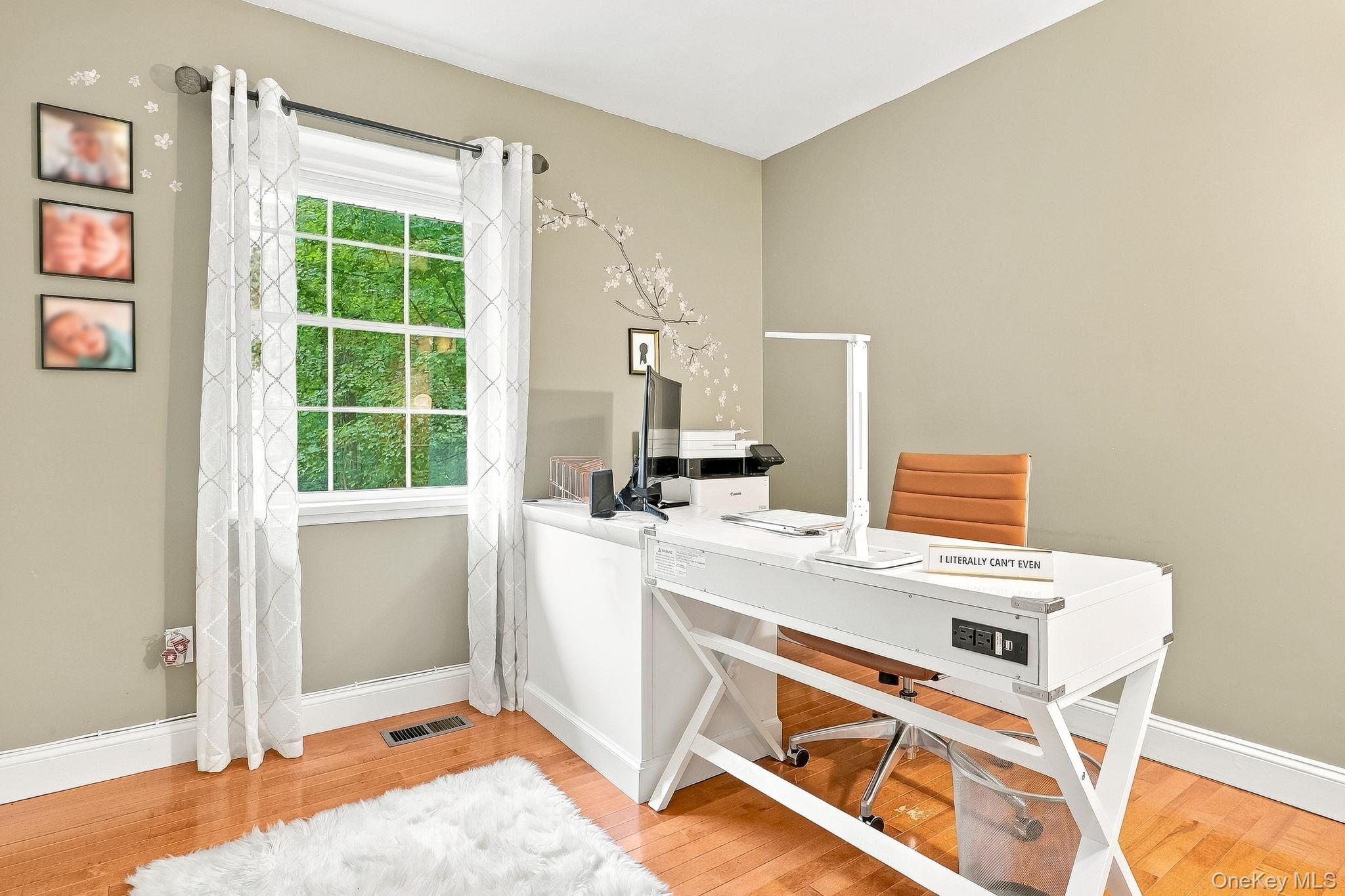 48 Mac Farlane Road Wappingers Falls, NY 12590 - Photo 20 of 47 Hardwood flooring, neutral wall paint, white trim, and a multi-pane window