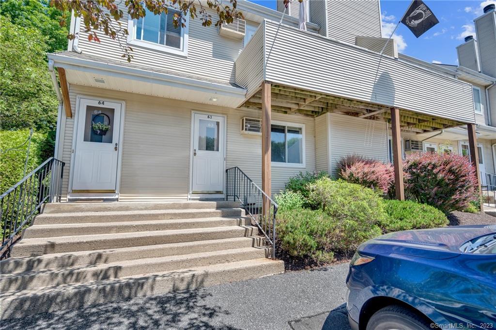 136 Pembroke Road, Unit 863 Danbury, CT 06811 - Photo 1 of 1 a view of a house with potted plants