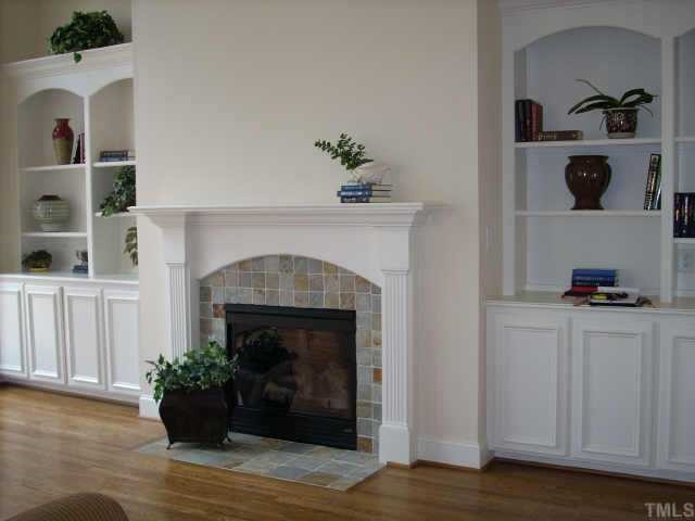The family room also features a gas log fireplace and plenty of storage & display space in the large built-ins. Other