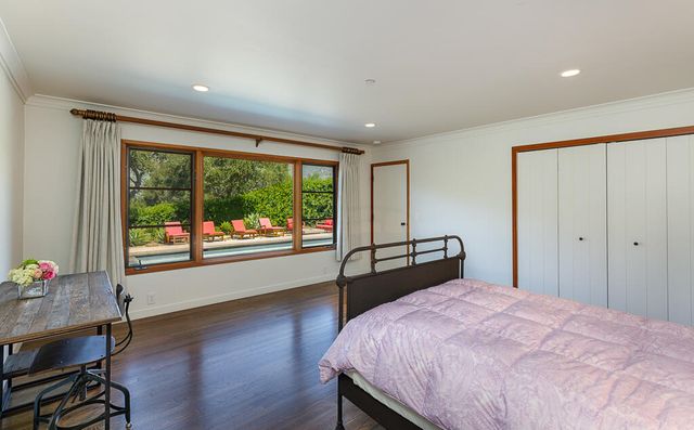a view of entryway with wooden floor and stairs
