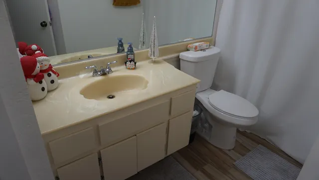 a bedroom with a bed and a table in it