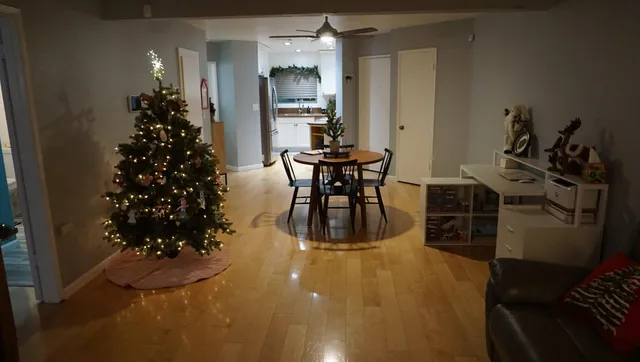 a dining room with furniture and wooden floor
