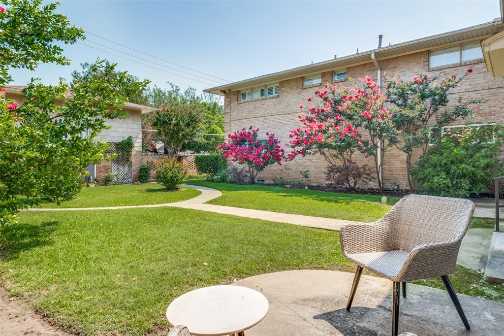 6131 Bandera Avenue, Unit A Dallas, TX 75225 - Photo 12 of 13 a view of a chair and table in the garden with potted plants