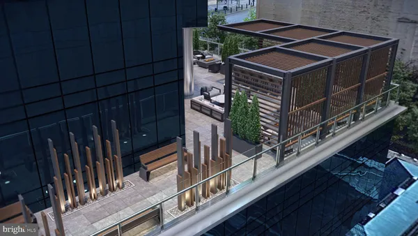 a balcony with furniture and a potted plant