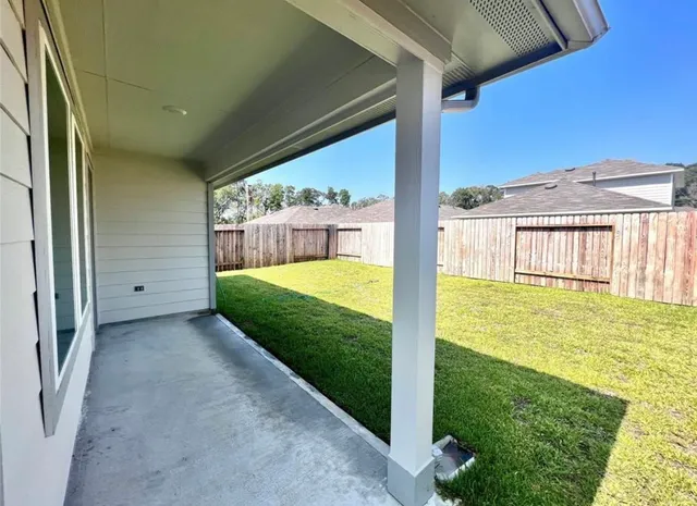 a view of a back yard of a house