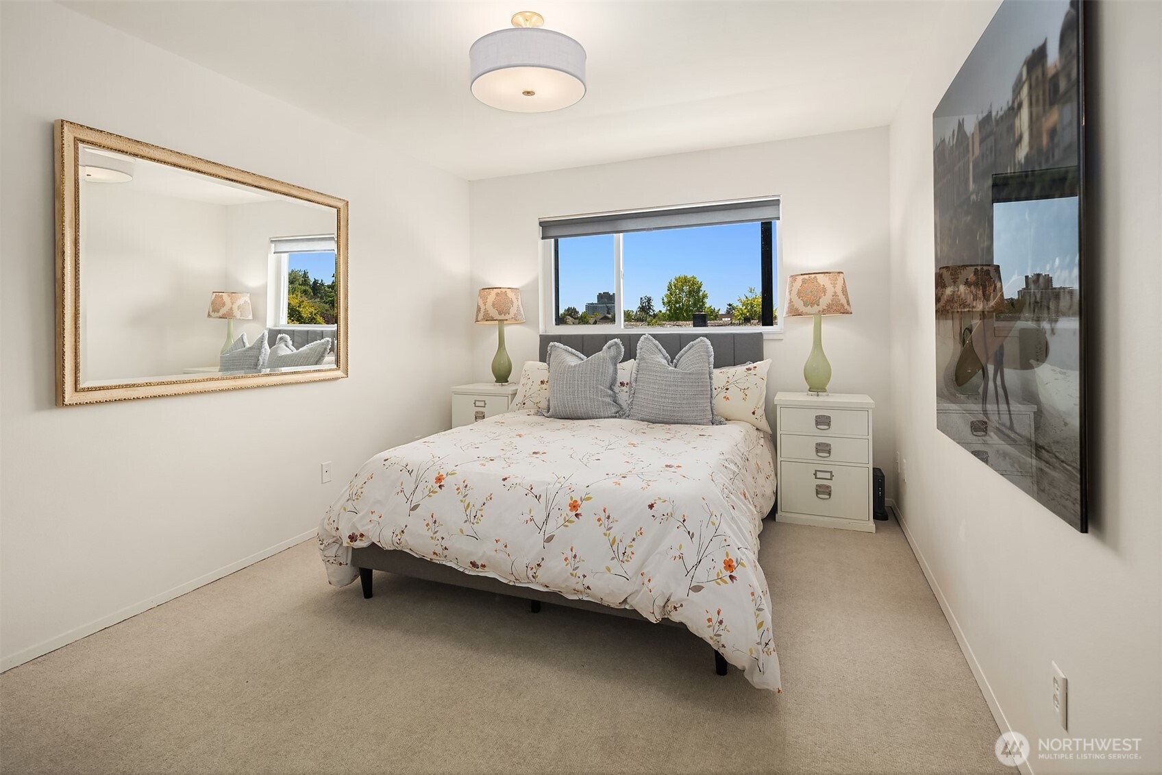 2500 Canterbury Lane East, Unit 302 Seattle, WA 98112 - Photo 11 of 33 a bedroom with a bed and a painting on the wall