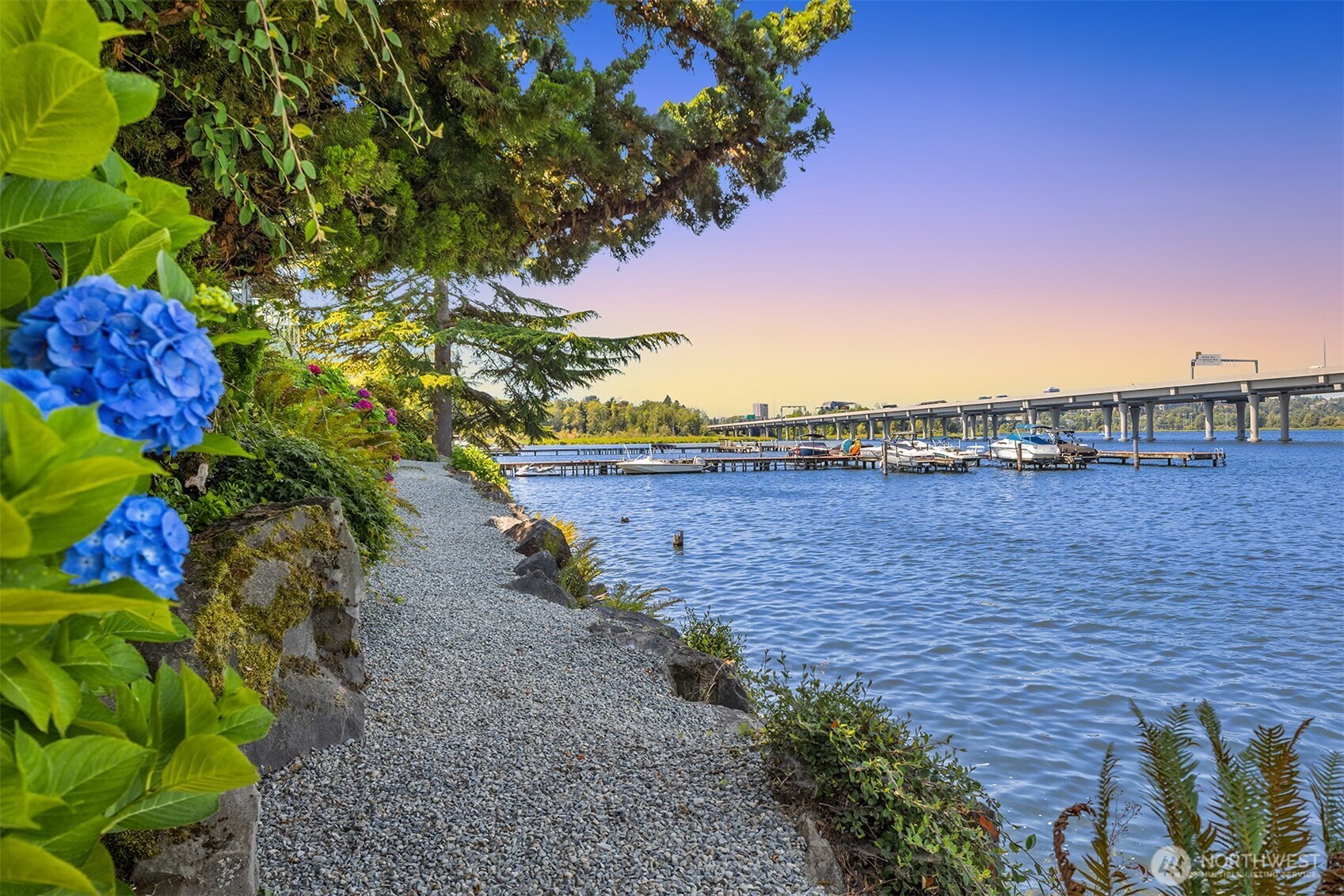 2500 Canterbury Lane East, Unit 302 Seattle, WA 98112 - Photo 24 of 33 a view of a lake with a building in the background