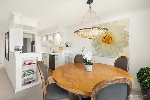 a dining room with furniture and window