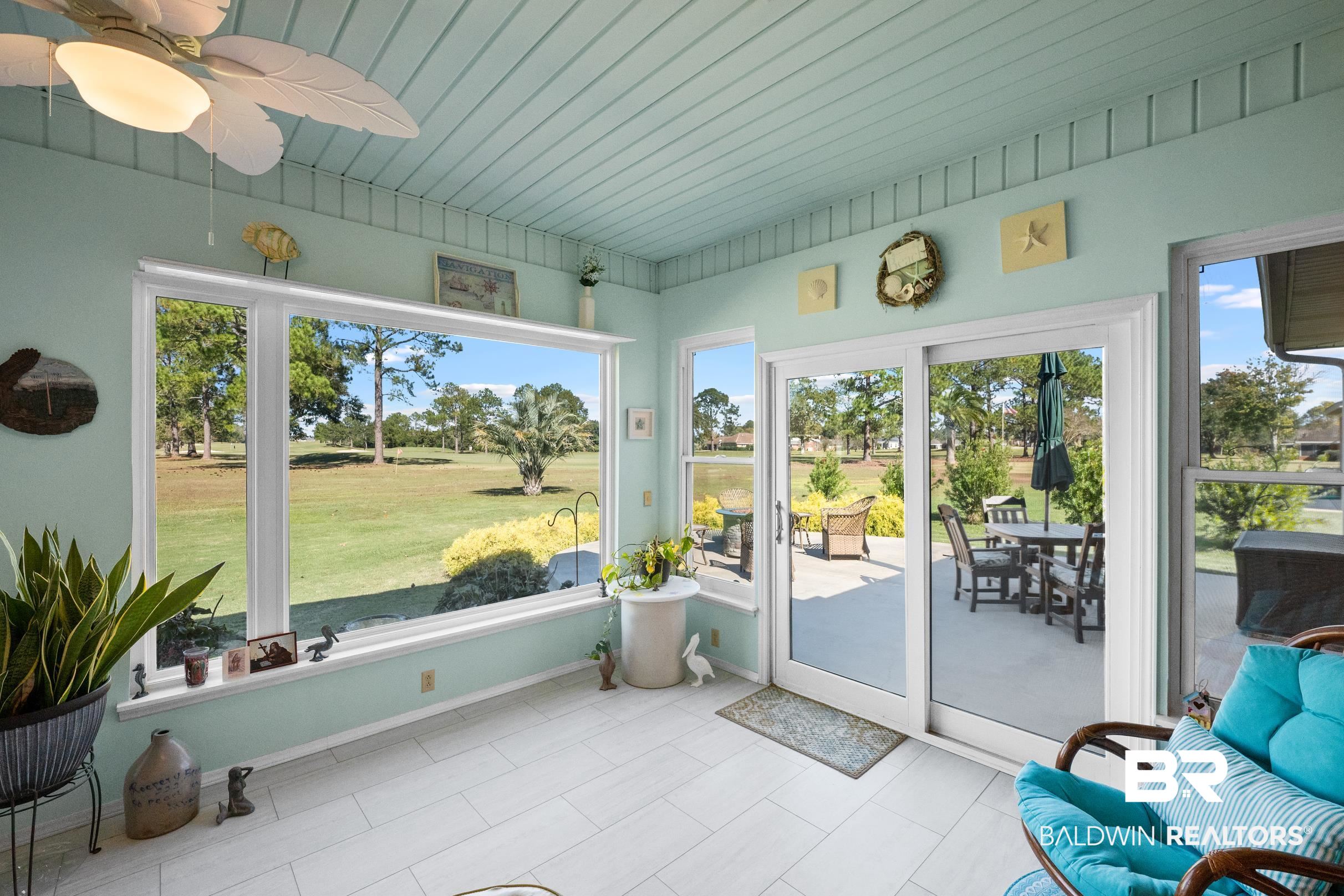 22355 East County Road 12 Foley, AL 36535 - Photo 42 of 54 Sunroom / solarium with healthy amount of natural light, tile patterned floors, and wood ceiling