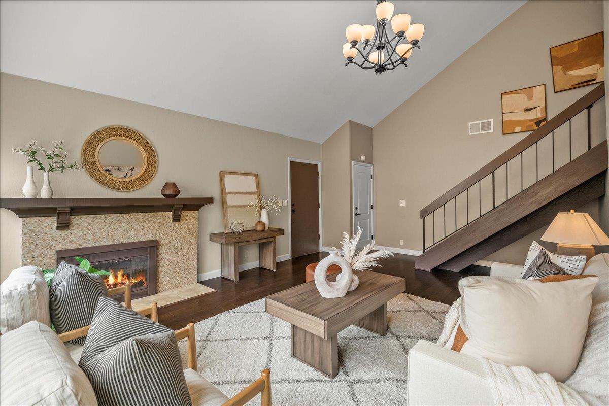 4118 Rosenbaum Avenue San Jose, CA 95136 - Photo 11 of 55 a living room with furniture a fireplace and a dining table