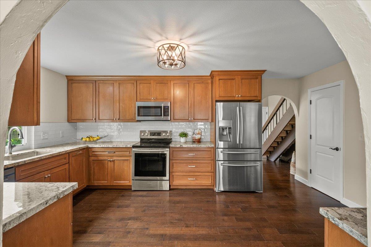 4118 Rosenbaum Avenue San Jose, CA 95136 - Photo 15 of 55 a kitchen with a sink stainless steel appliances and cabinets