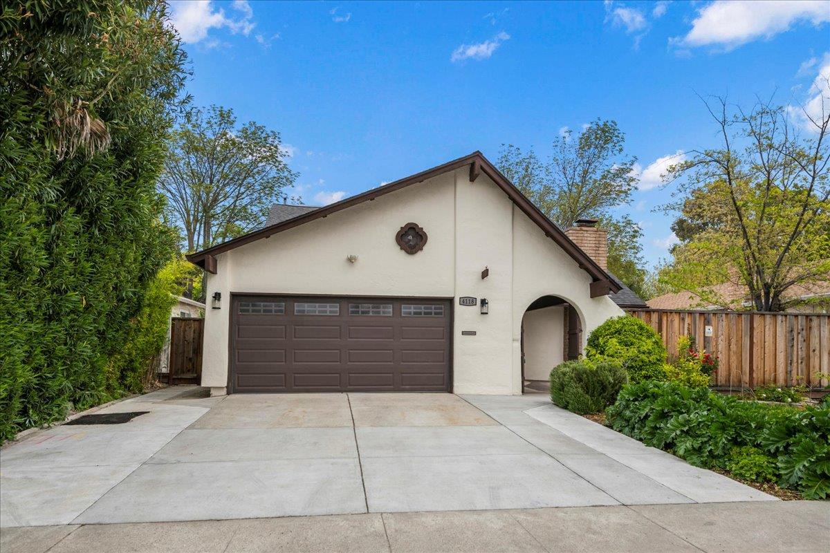 4118 Rosenbaum Avenue San Jose, CA 95136 - Photo 2 of 55 a front view of a house with a yard and garage