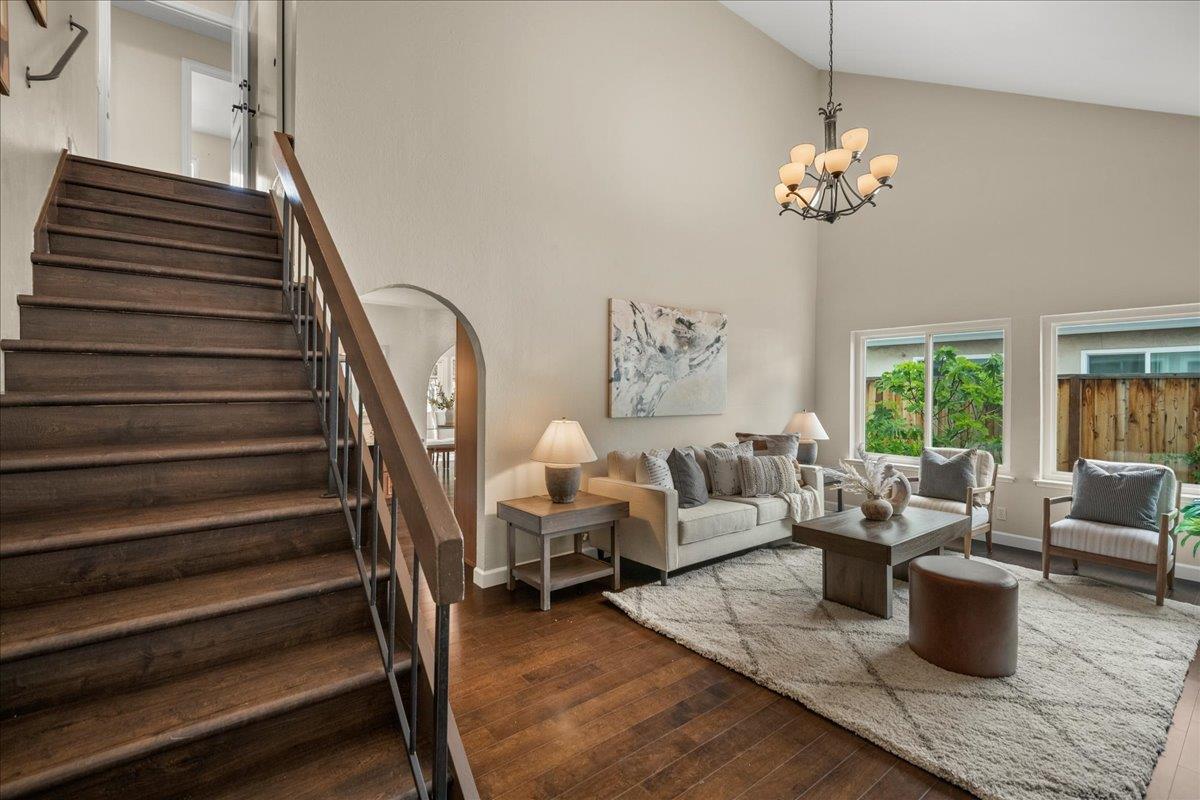 4118 Rosenbaum Avenue San Jose, CA 95136 - Photo 23 of 55 a living room with furniture a fireplace and a chandelier