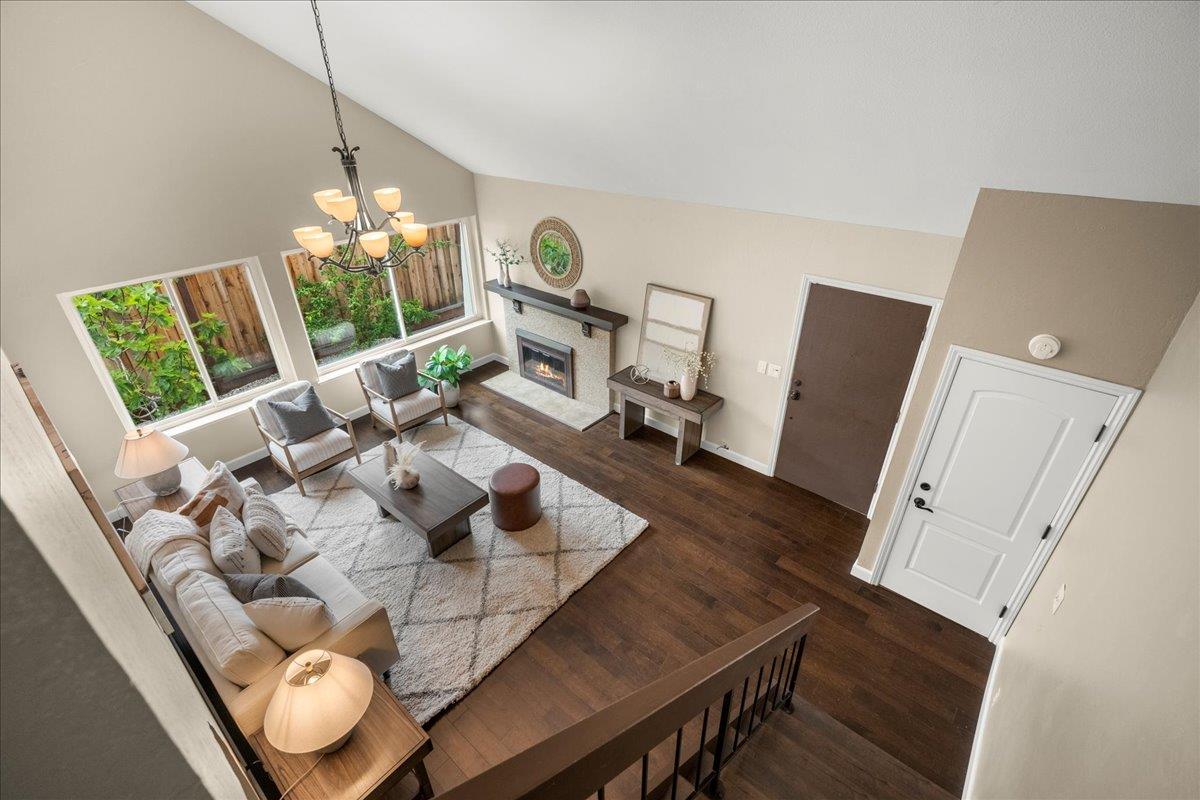 4118 Rosenbaum Avenue San Jose, CA 95136 - Photo 24 of 55 a view of a dining room with furniture wooden floor and chandelier
