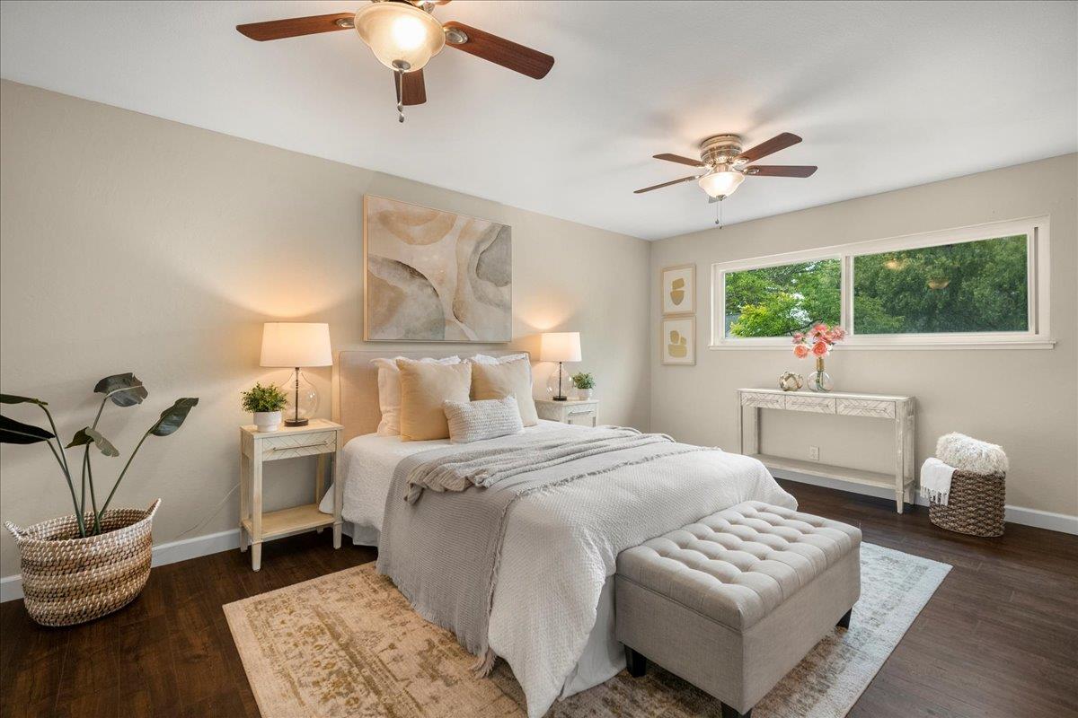 4118 Rosenbaum Avenue San Jose, CA 95136 - Photo 25 of 55 a bedroom with a bed and a chandelier