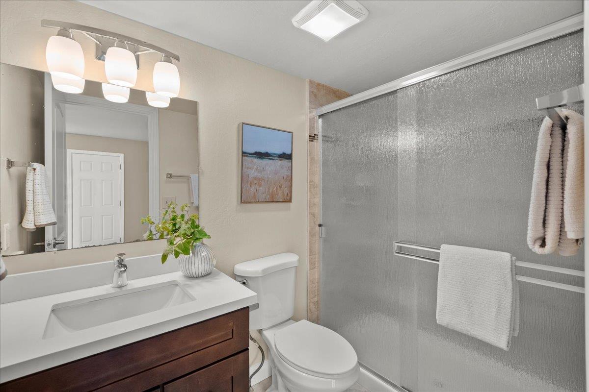 4118 Rosenbaum Avenue San Jose, CA 95136 - Photo 39 of 55 a bathroom with a sink vanity granite toilet and a mirror