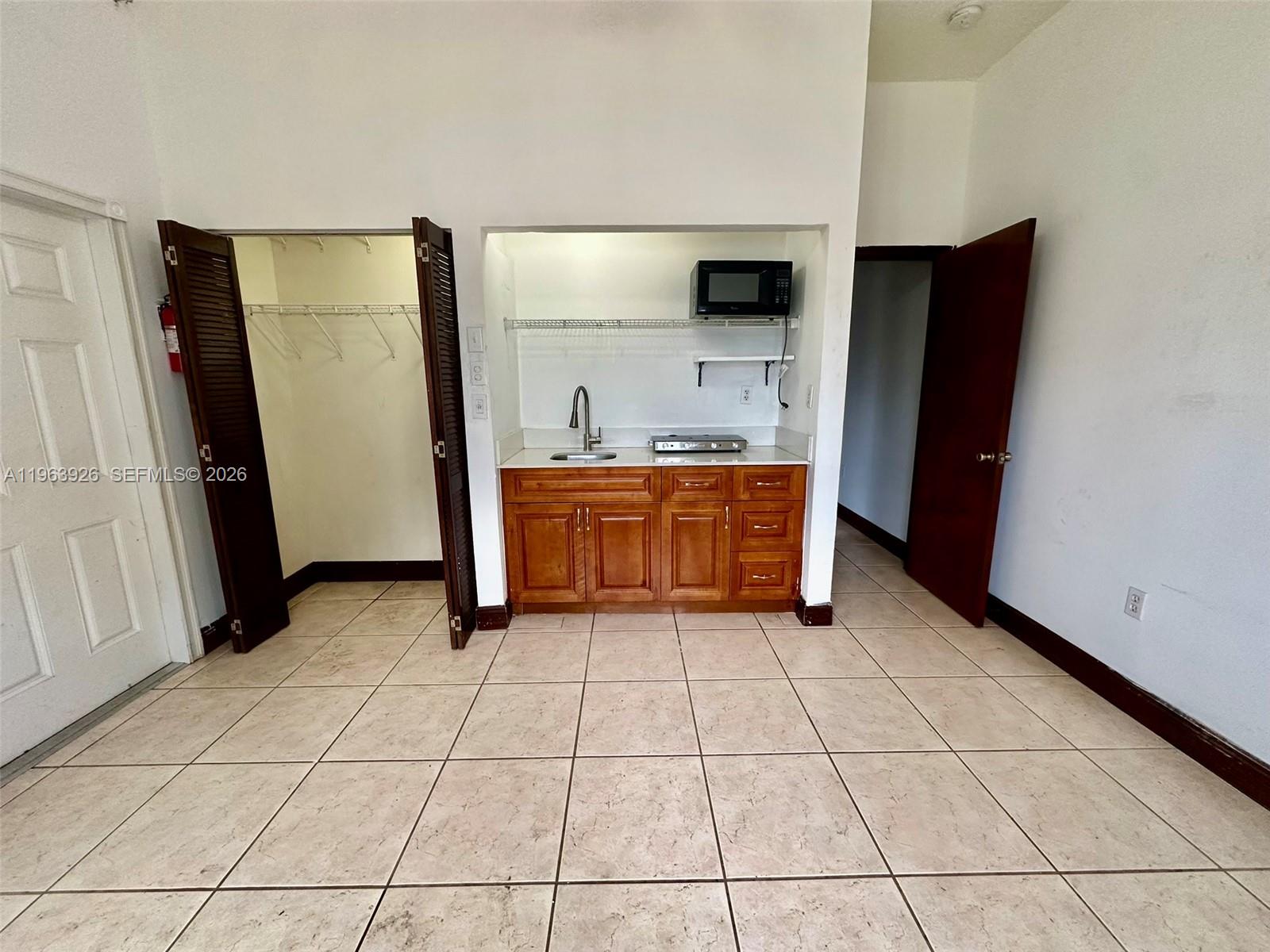21731 Southwest 127th Court Miami, FL 33170 - Photo 2 of 10 a kitchen with stainless steel appliances a sink and a refrigerator