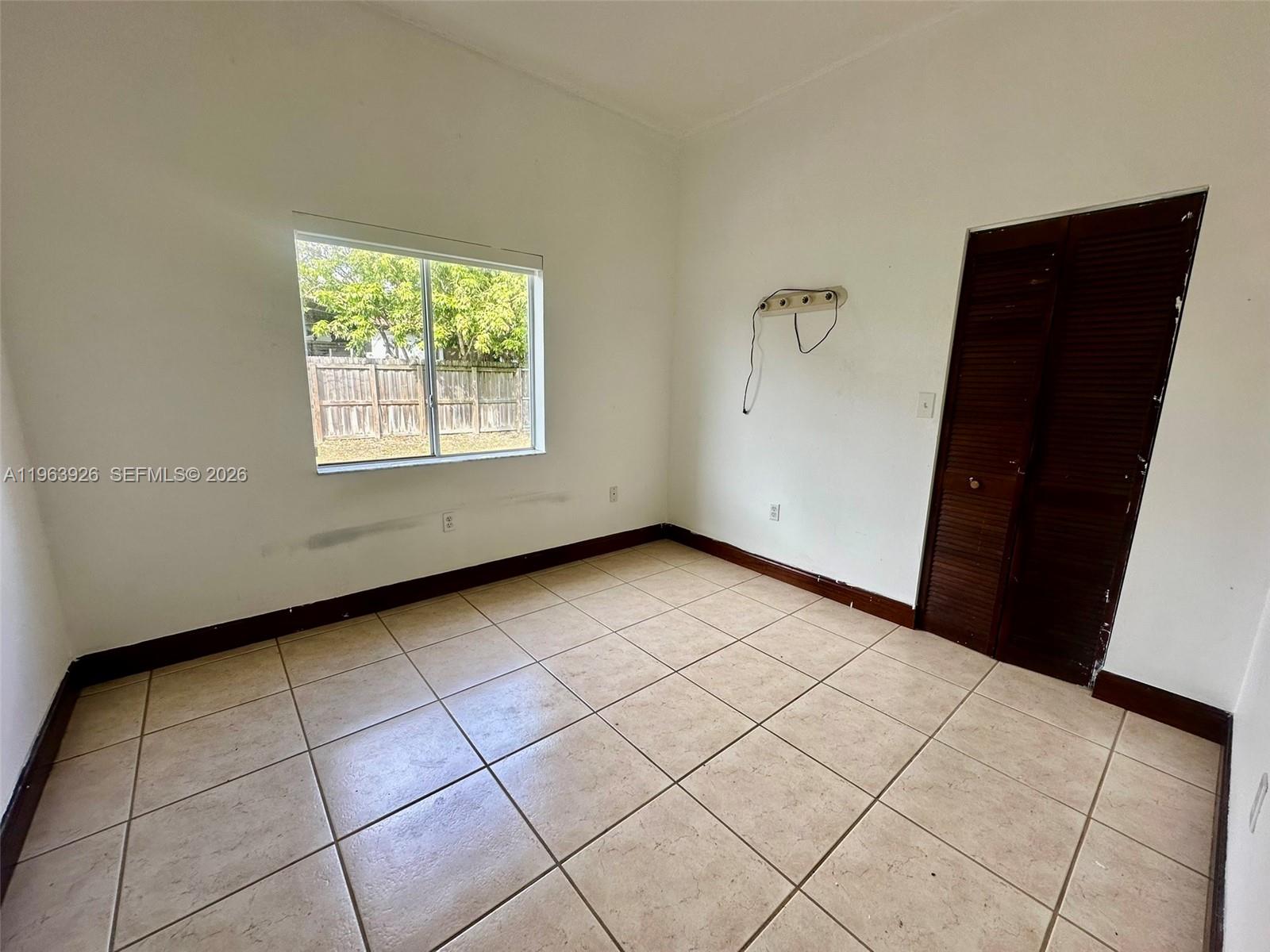21731 Southwest 127th Court Miami, FL 33170 - Photo 5 of 10 en empty room with windows