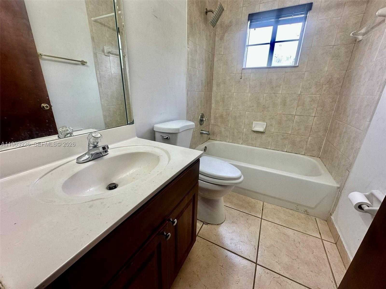 21731 Southwest 127th Court Miami, FL 33170 - Photo 6 of 10 a bathroom with a sink a toilet and bathtub