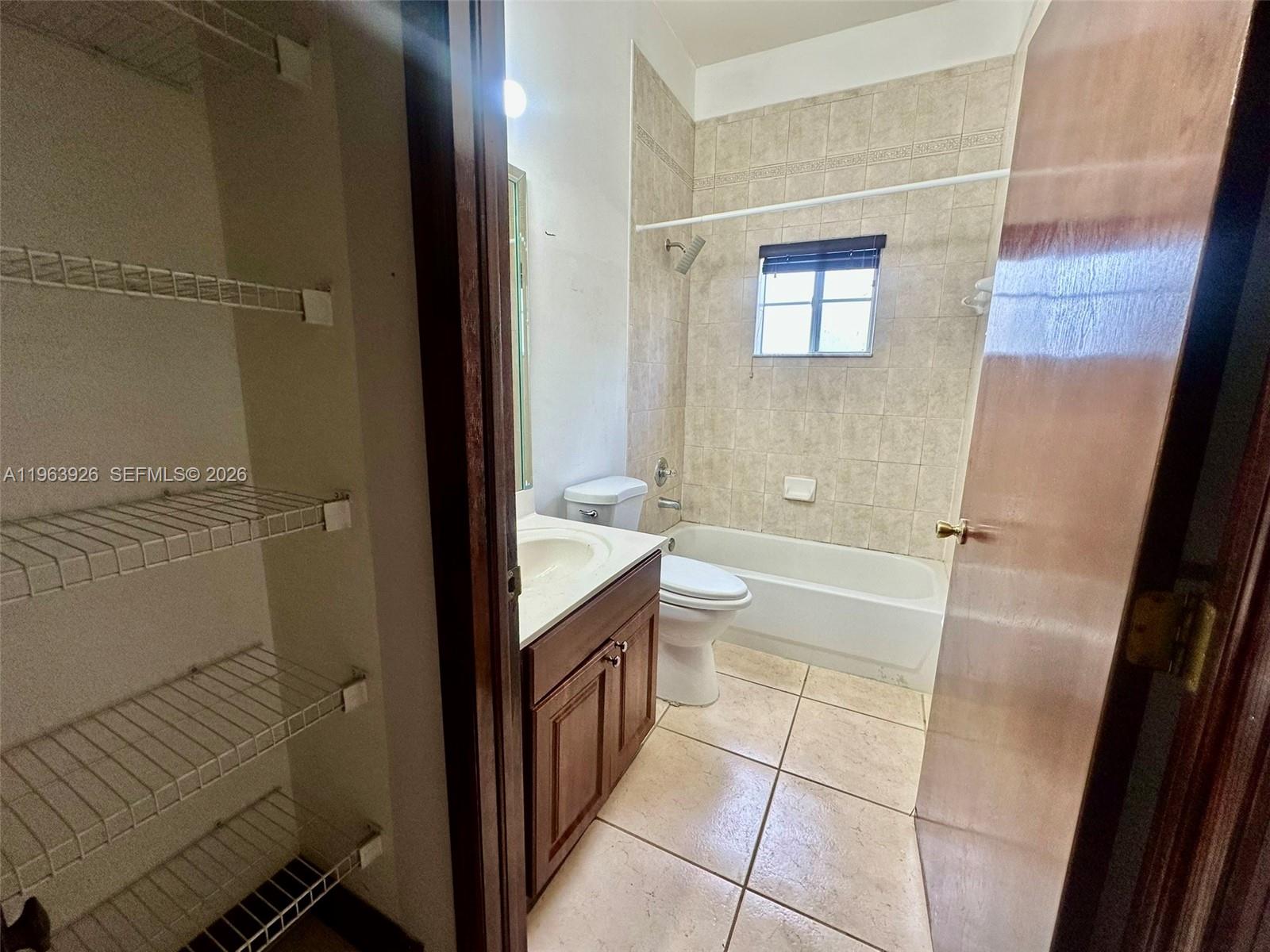 21731 Southwest 127th Court Miami, FL 33170 - Photo 7 of 10 a bathroom with a granite countertop sink toilet and shower