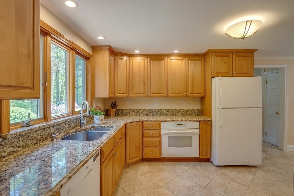 51 Towne Road Boxford, MA 01921 - Photo 11 of 39 a kitchen with a refrigerator sink and cabinets