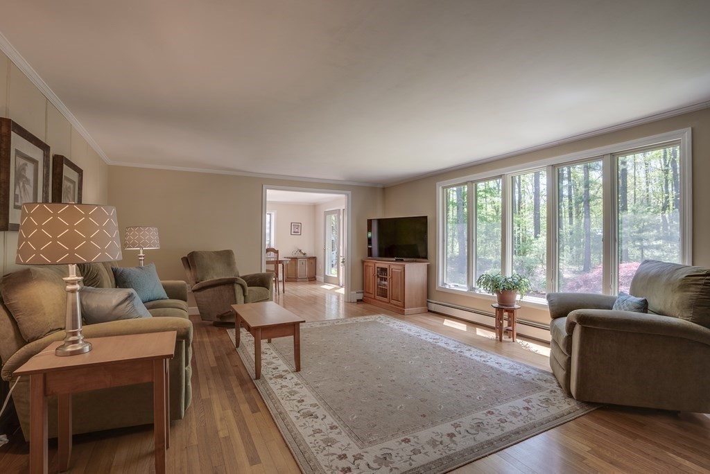 51 Towne Road Boxford, MA 01921 - Photo 16 of 39 a living room with furniture and a flat screen tv