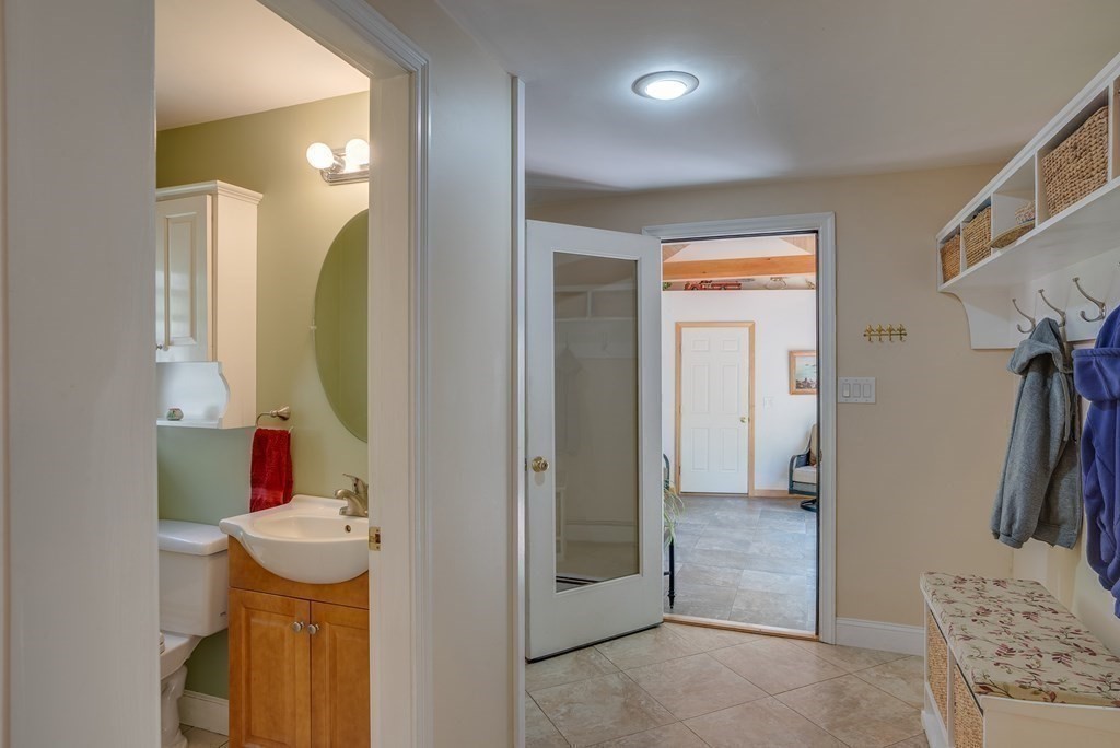 51 Towne Road Boxford, MA 01921 - Photo 24 of 39 a bathroom with a sink and mirror with toilet