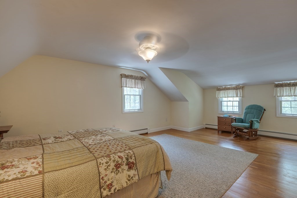 51 Towne Road Boxford, MA 01921 - Photo 31 of 39 a bedroom with a bed window and chair