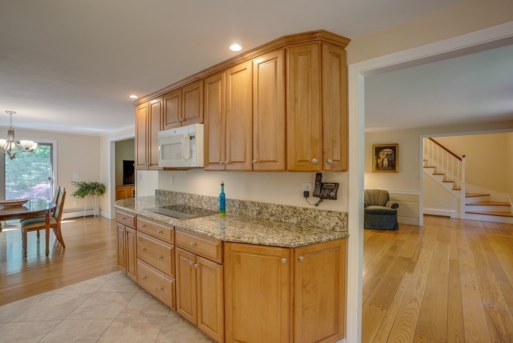 51 Towne Road Boxford, MA 01921 - Photo 10 of 39 a kitchen with stainless steel appliances granite countertop a sink stove and cabinets