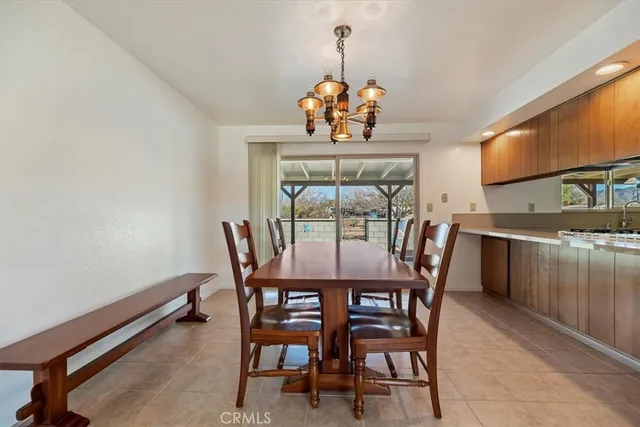 a kitchen with stainless steel appliances kitchen island granite countertop a refrigerator and stove top oven