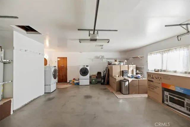 a bathroom with a tub and a view of living room