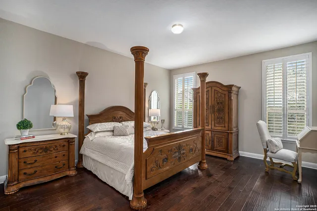 a bedroom with furniture and a window