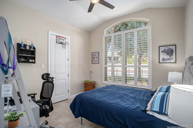 a bedroom with furniture and a window