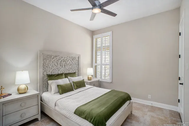 a bedroom with a bed and window