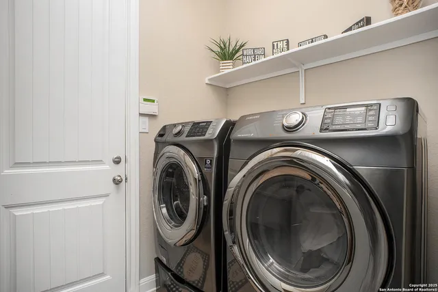 a utility room with dryer and washer